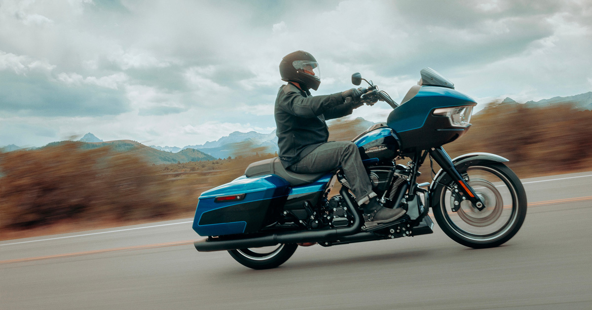 2026 Harley-Davidson blue Road Glide cruising along the highway 