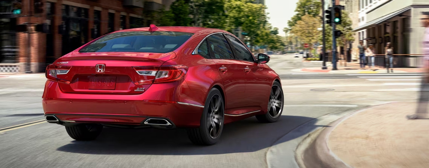 Red 2022 Honda Accord Touring rounding a corner