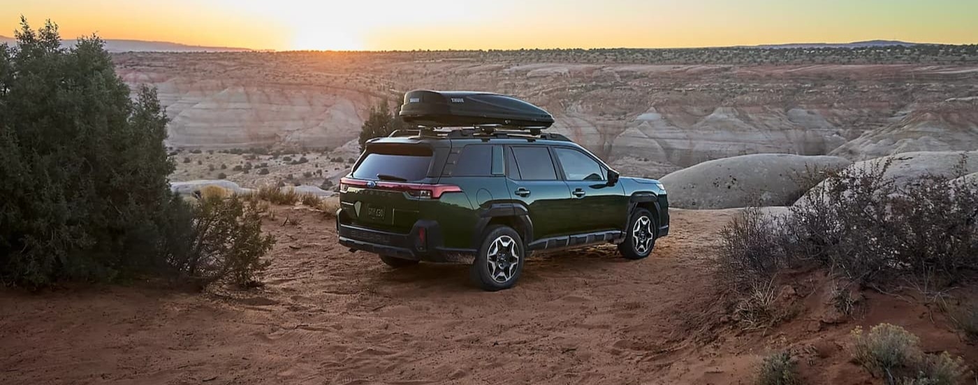 Green 2026 Subaru Outback parked off-road