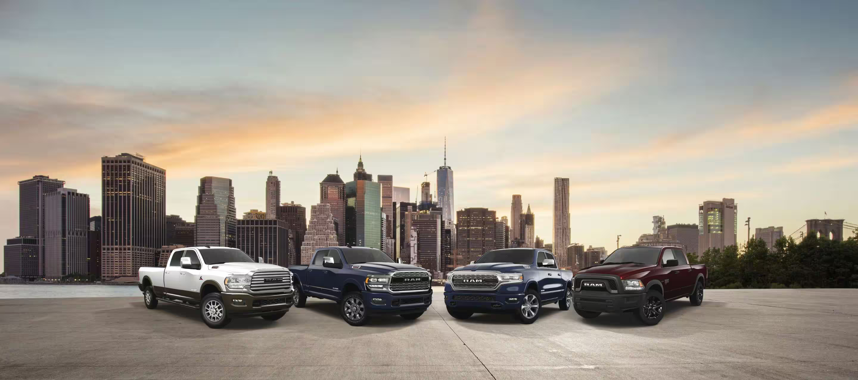 a lineup of trucks with a city scape background