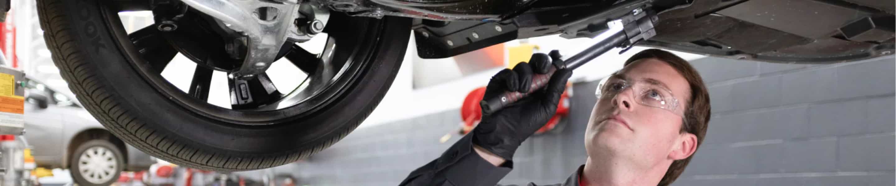 Mechanic working on vehicle