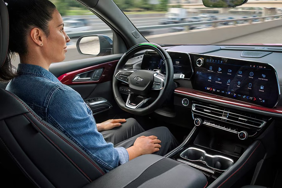 Chevy Super Cruise Being Used in Chevrolet Vehicle Interior Cabin Dashboard Driver Hands on Lap