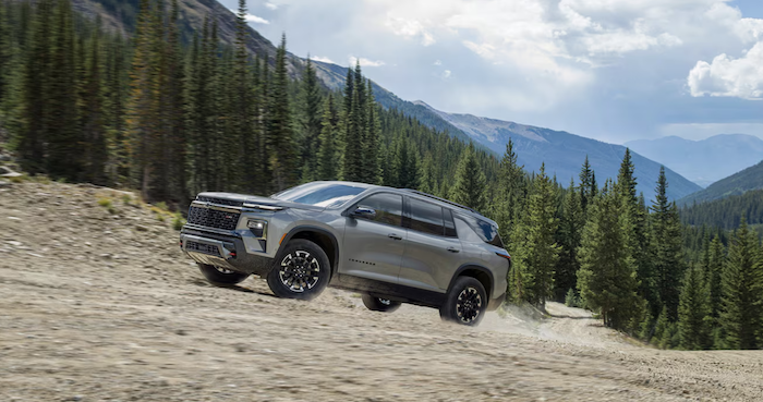 used chevy SUV driving across landscape
