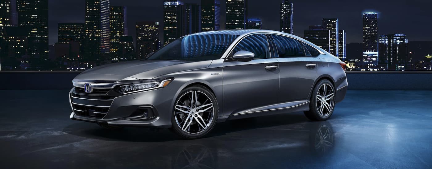 A grey 2022 Honda Accord Hybrid Touring is shown from the side.