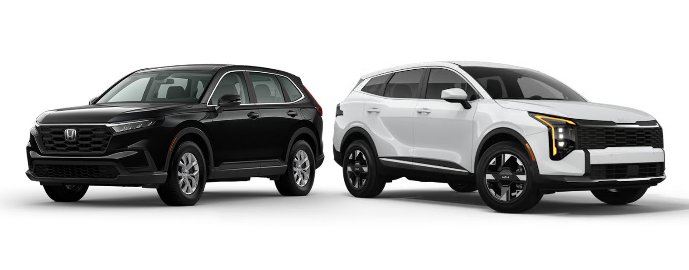 Black 2026 Honda CR-V angled left and a white 2026 Kia Sportage angled right.