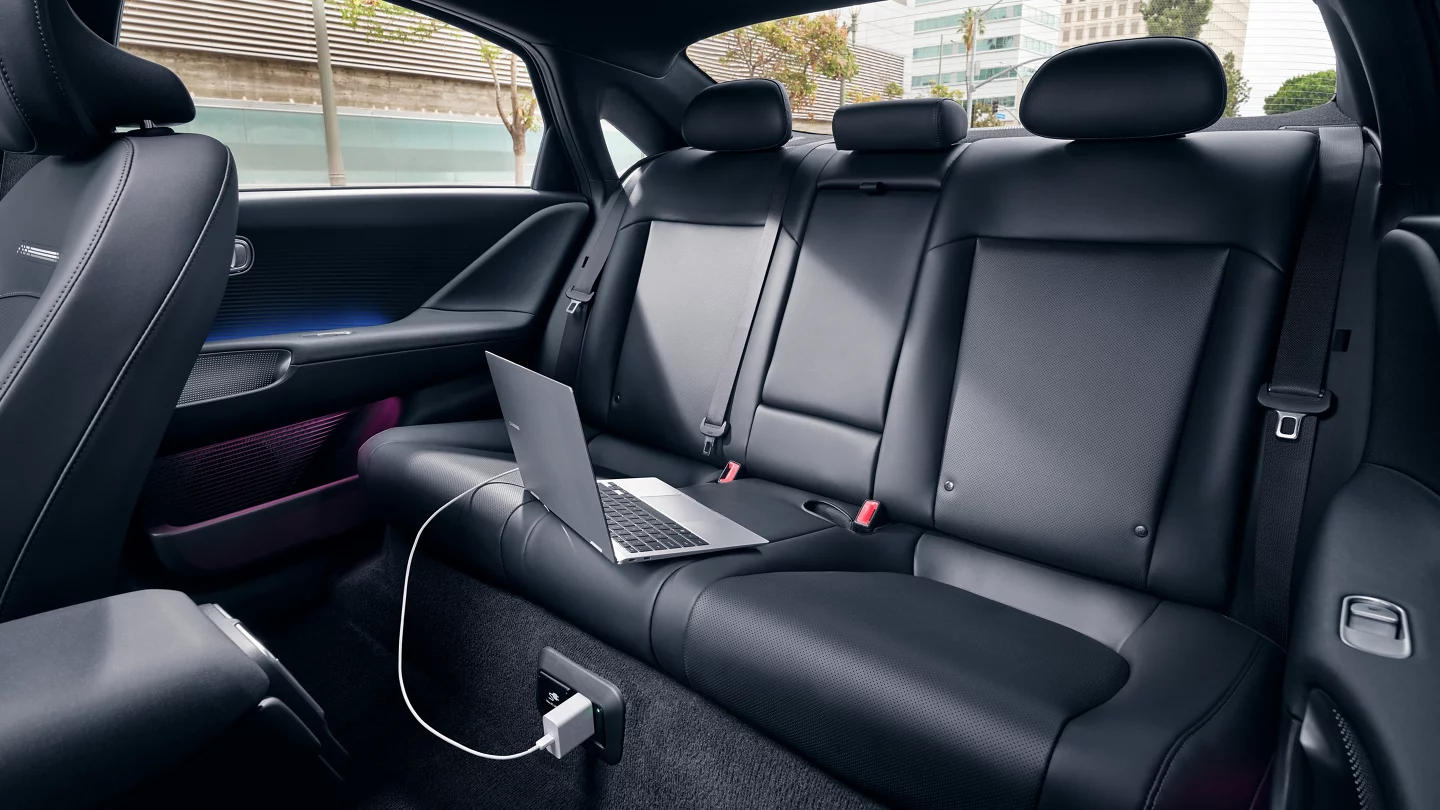 2025 Hyundai IONIQ 6 showcasing black leather interior backseats with a laptop charging 