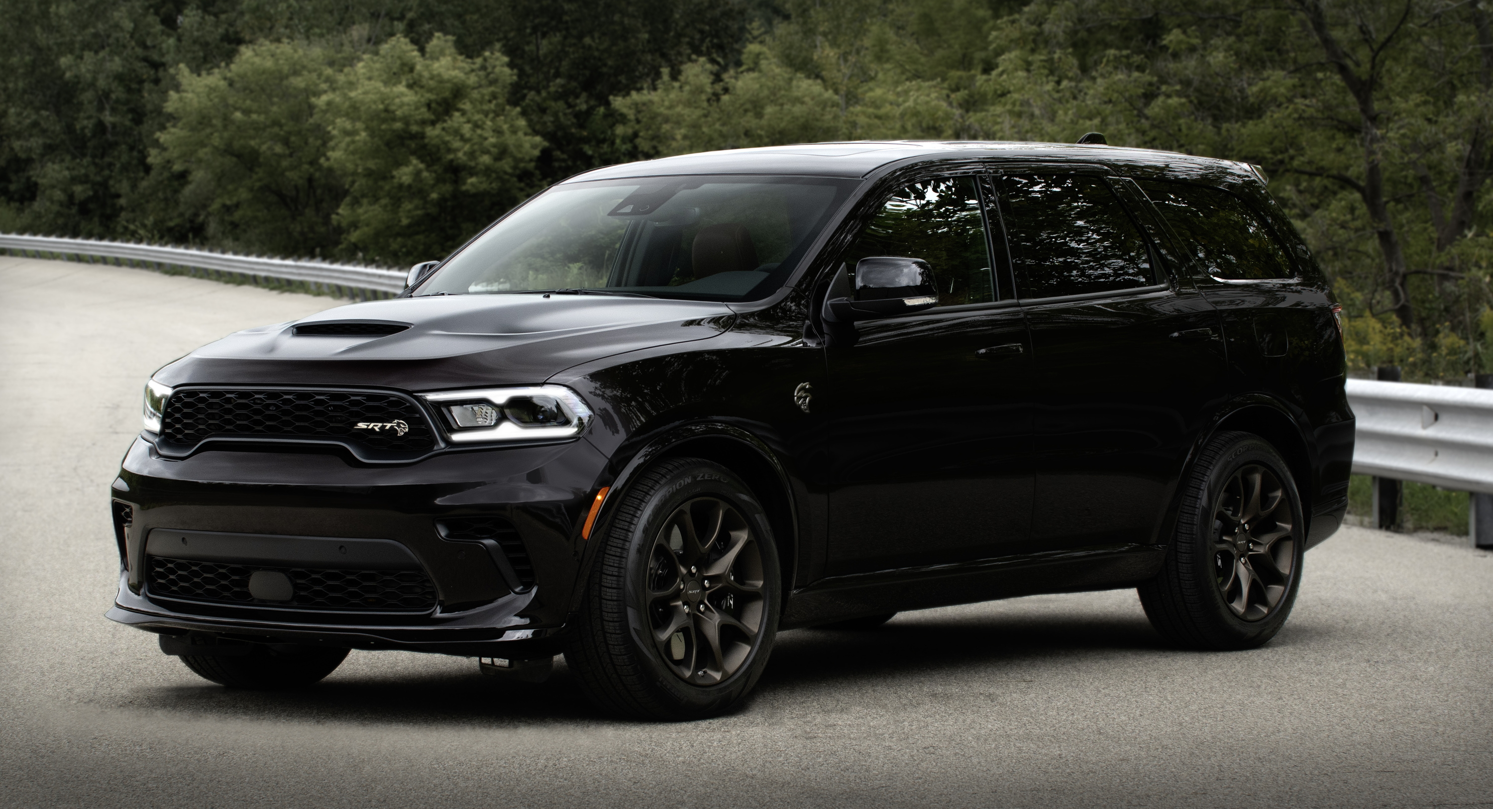 A black suv sitting parked.