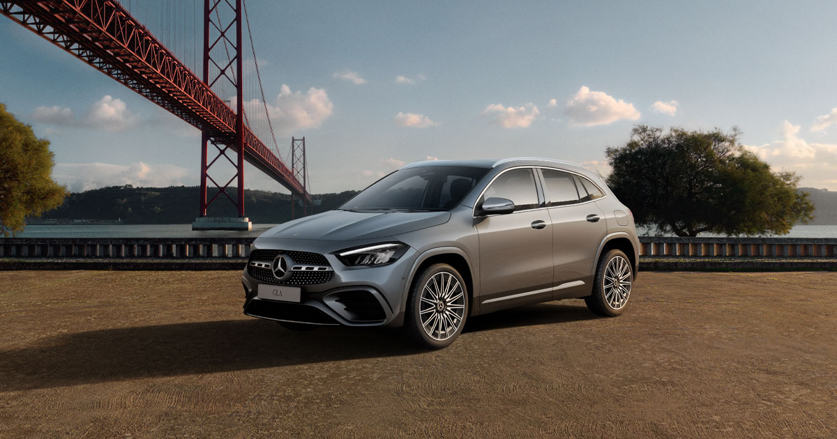 A Mercedes-Benz GLA compact luxury SUV parked near a suspension bridge.