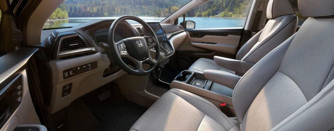 Front seats and dash in a 2021 Honda Odyssey Elite