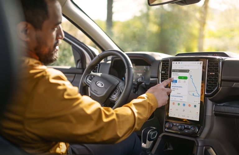 Man Using Touchscreen Navigation in 2025 Ford Ranger