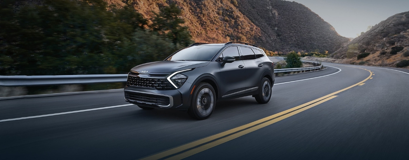 Grey 2023 Kia Sportage for Sale in Milwaukee driving on a highway