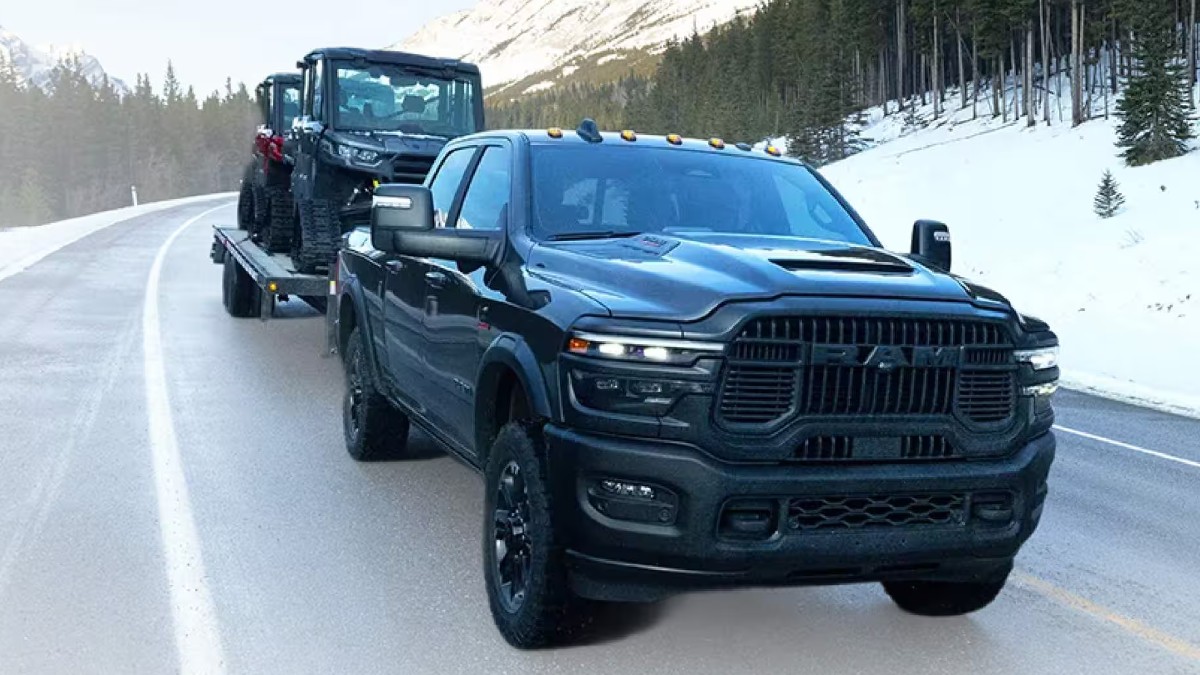 2026 RAM 1500 Exterior Passenger Side Front Angle while Towing ATVs