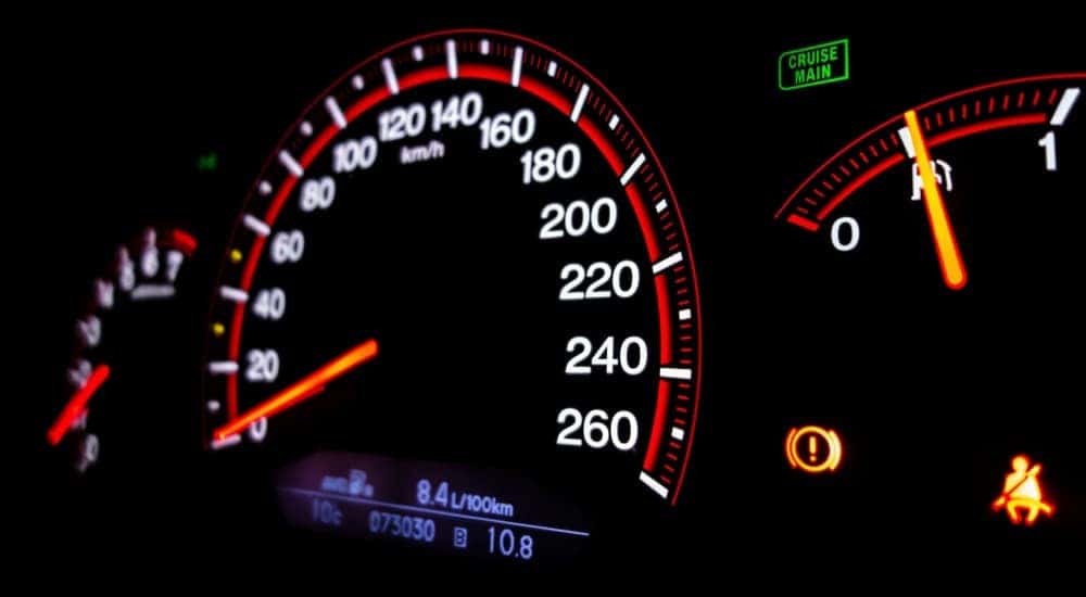 A vehicle's speedometer and dashboard lights