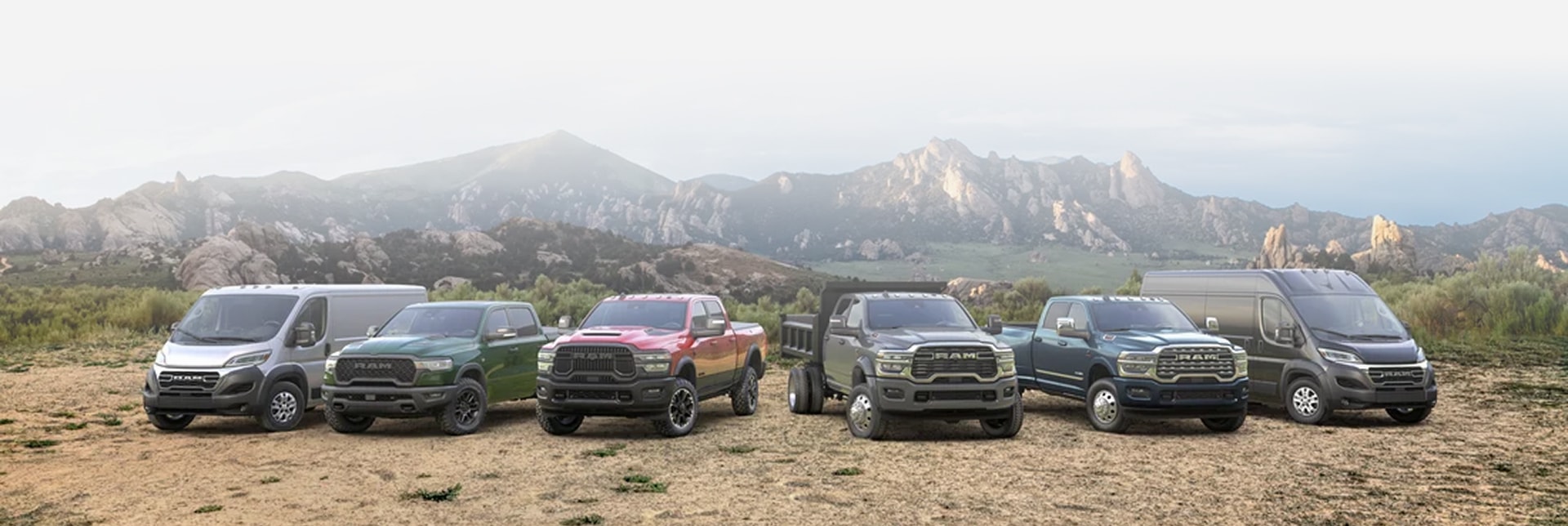 Ram Commercial Trucks and Vans parked in front of mountain range