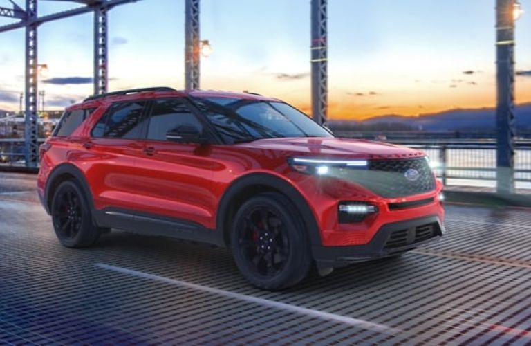 Red 2024 Ford Explorer ST Driving on a Bridge