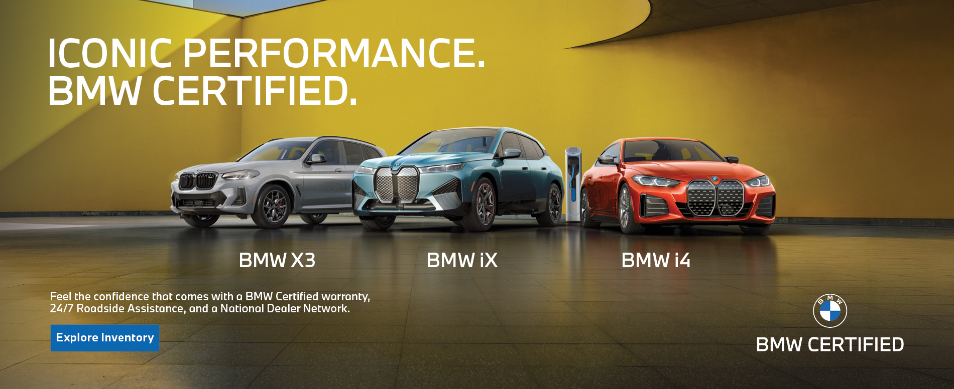 BMW Certified X3, iX, and i4 parked next to a colorful building wall.