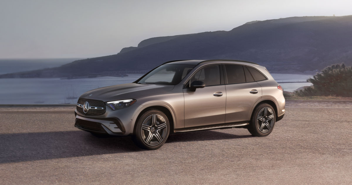 A silver Mercedes-Benz GLC parked by the ocean.