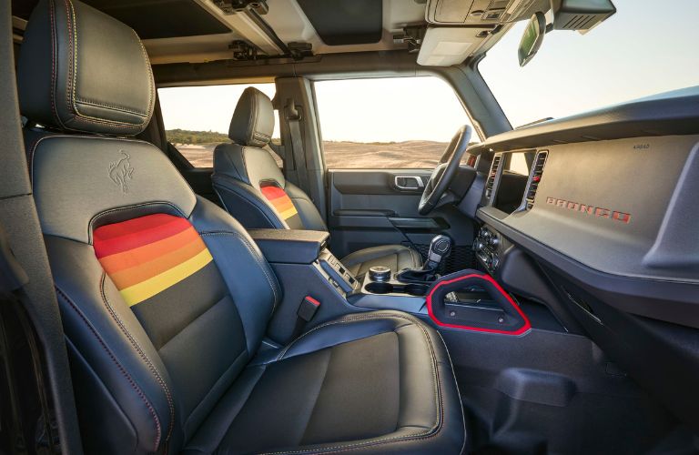 Front Seats with Orange, Red, and Yellow Accents in 2025 Ford Bronco Free Wheeling Edition