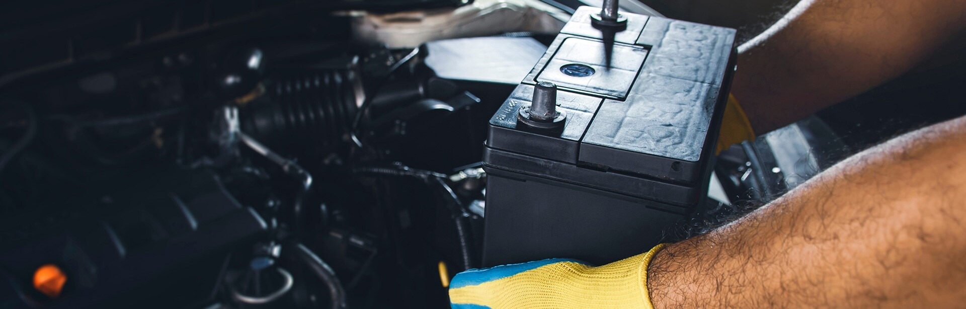Technician performing battery service at Cox Chrysler Dodge Jeep Ram