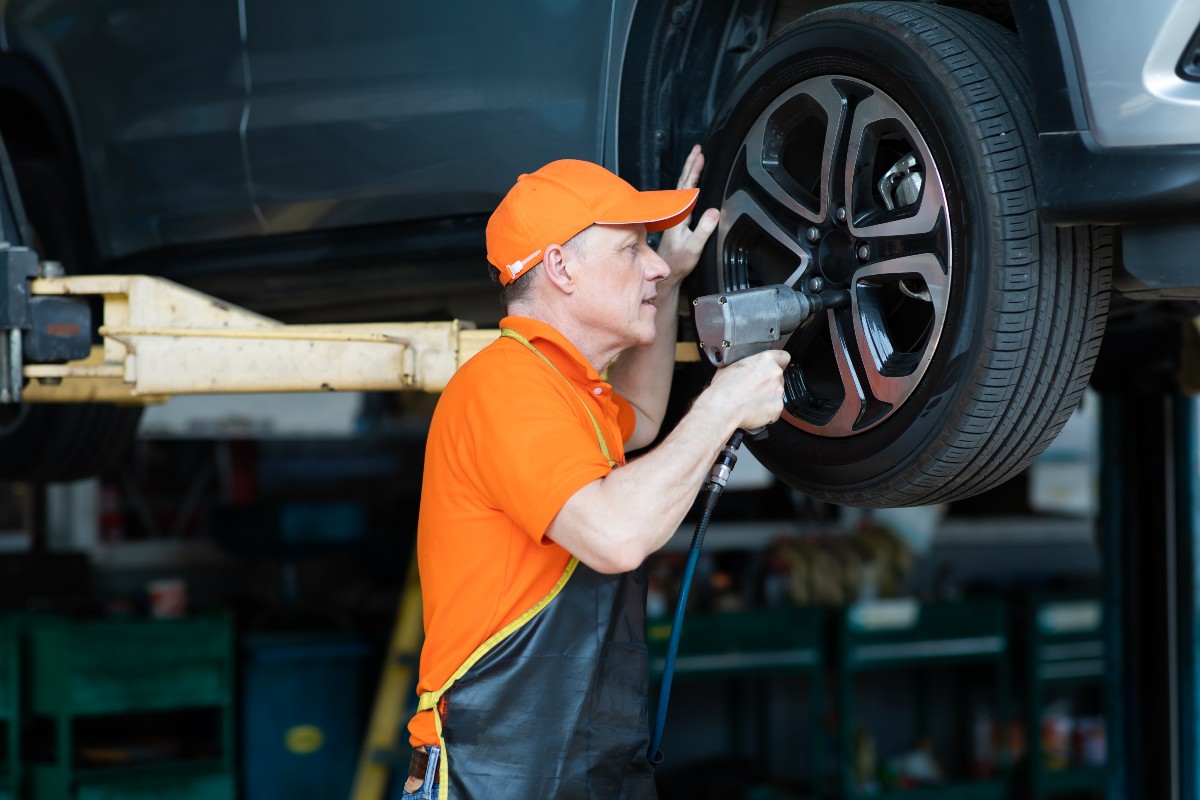 Service Technician Changing Tire