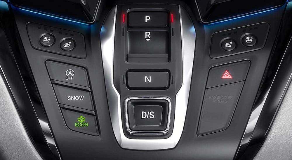 A closeup shows the shifting buttons and controls in a 2020 Honda Odyssey Elite.