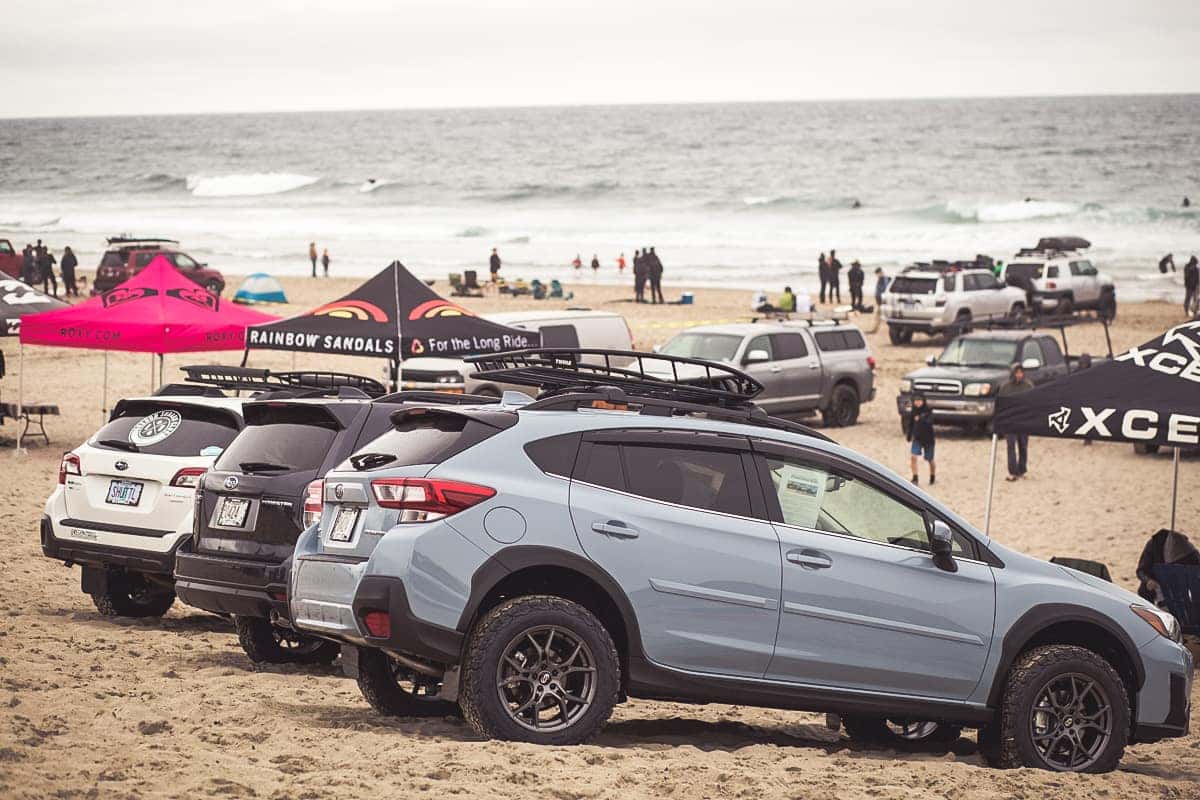 Subaru vehicles parked on the beach at Cape Kiwanda