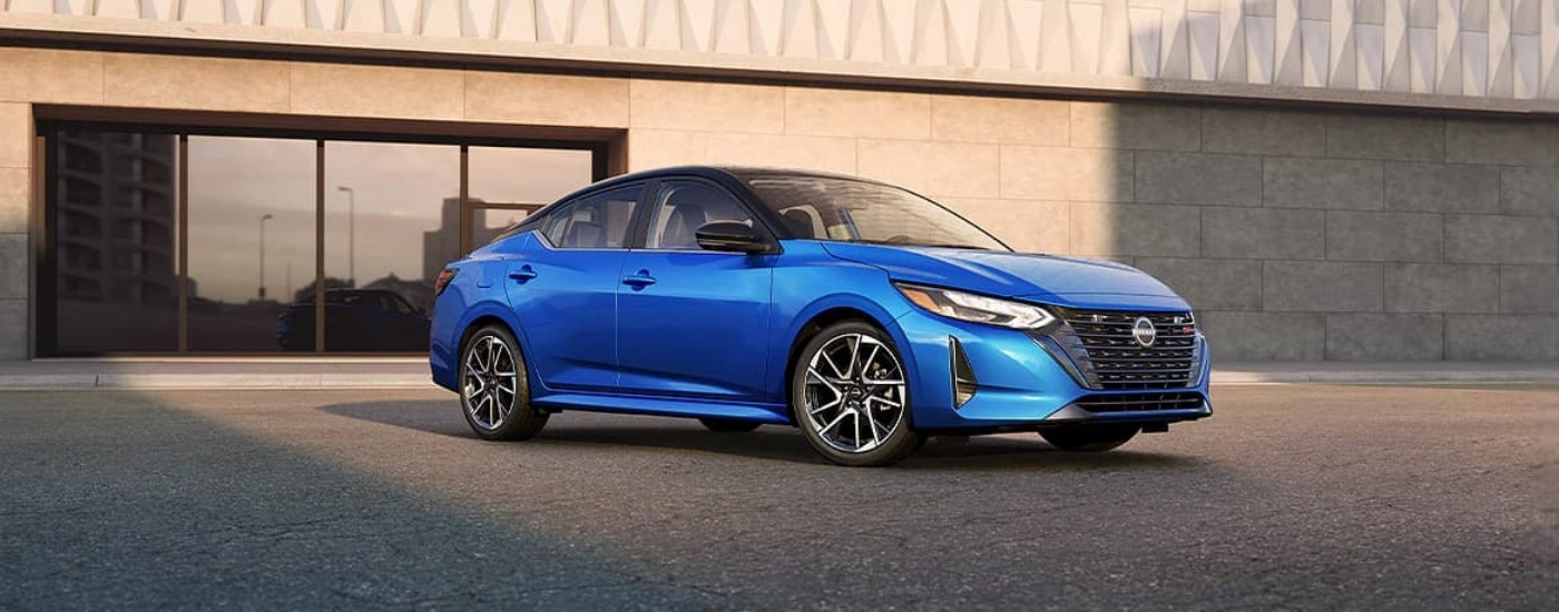 Blue 2024 Nissan Sentra SR parked at a Nissan dealer near Golden Valle