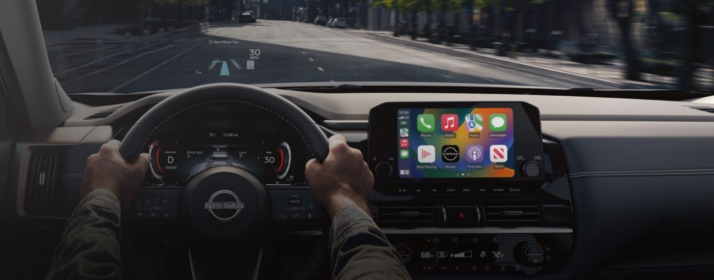 Person steering a 2026 Nissan Pathfinder 