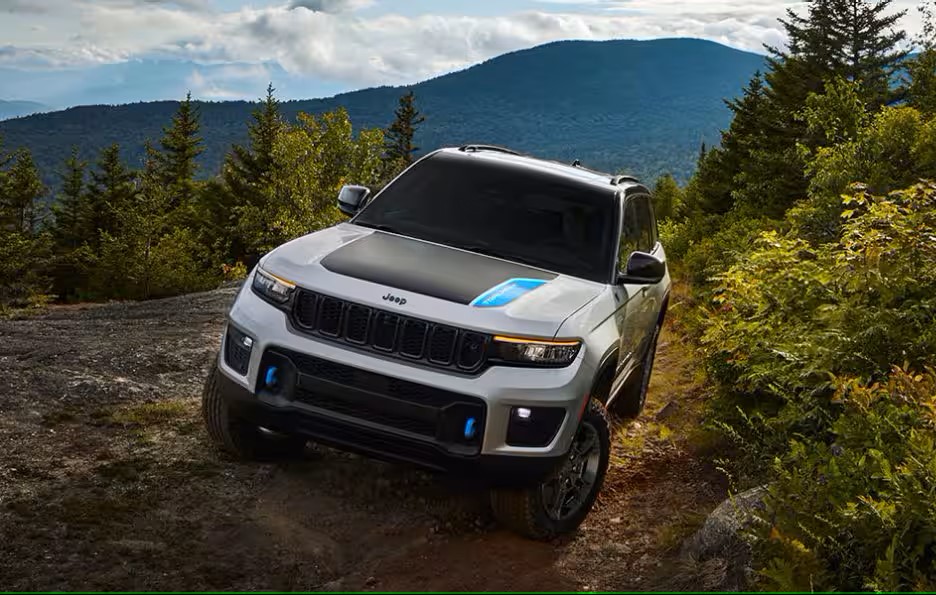 a silver suv driving in the mountains