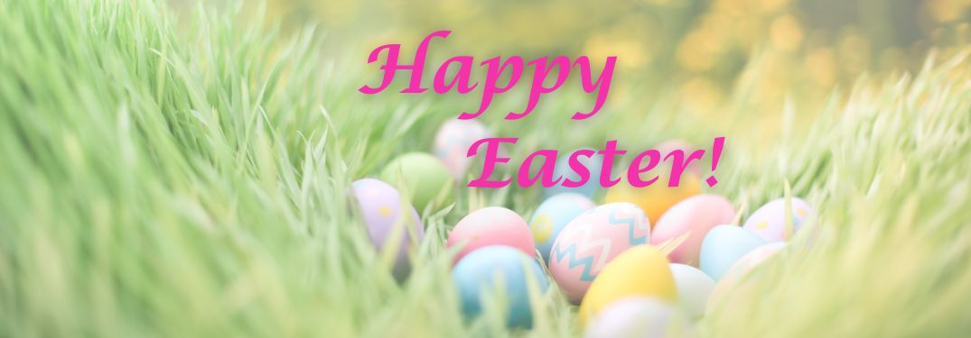 Easter Eggs in Grass with Pink Happy Easter Text