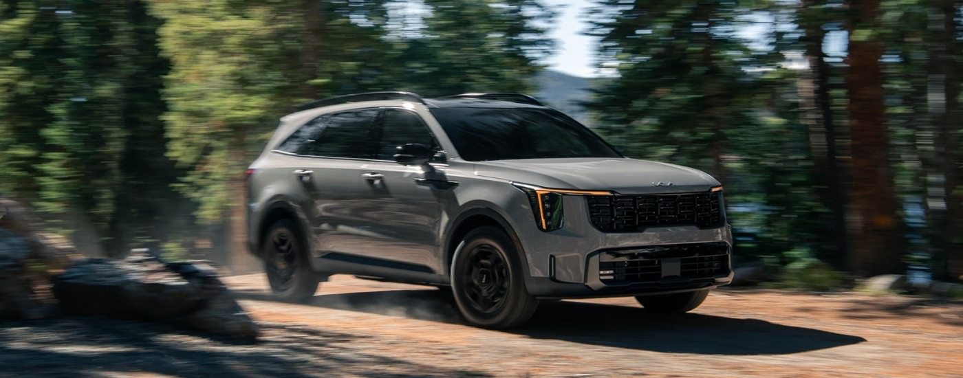 Gray 2025 Kia Sorento driving off-road