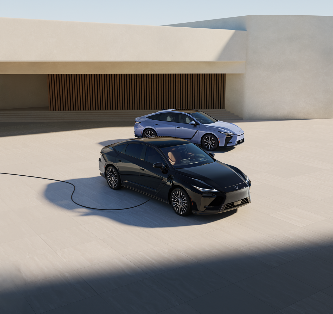 Lexus ES Hybrid alongside a Lexus ES 500e, which is connected to a home charging station.