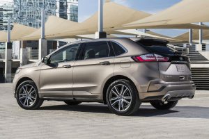 side view of a tan 2019 Ford Edge Titanium Elite