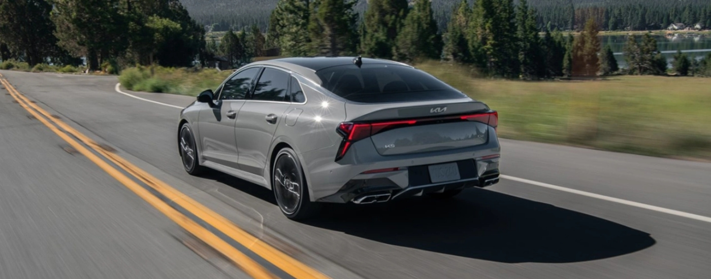 Grey 2025 Kia K5 GT driving on a highway