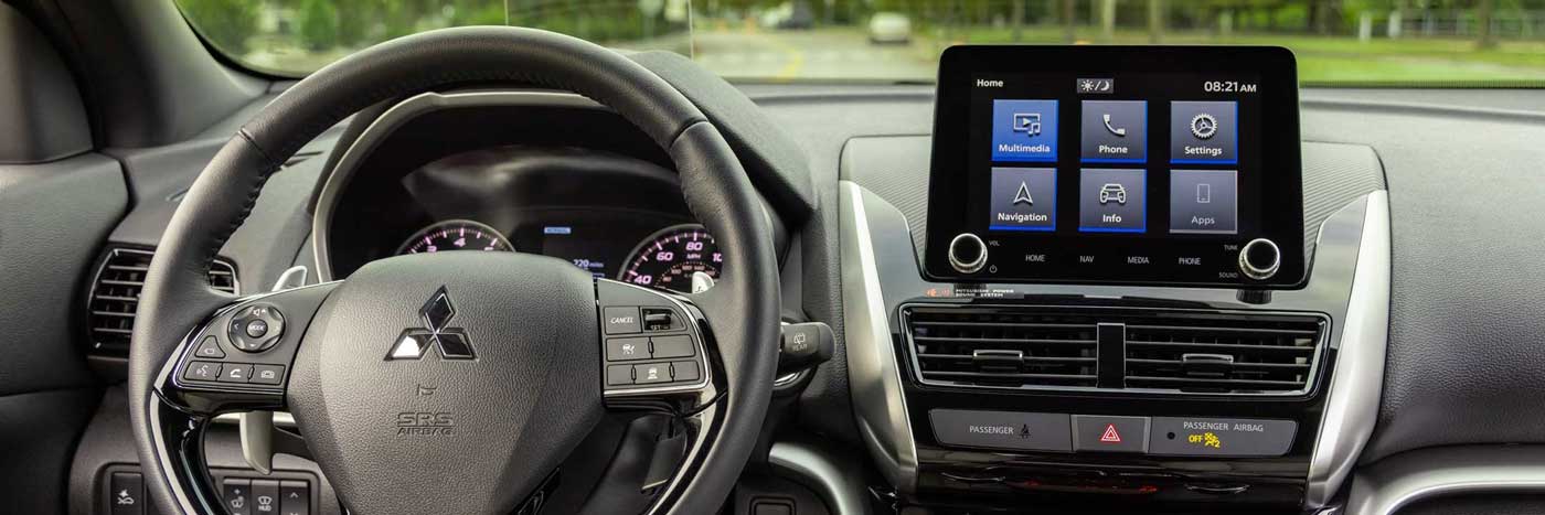 Interior dashboard view of a car, showing the infotainment screen and controls.