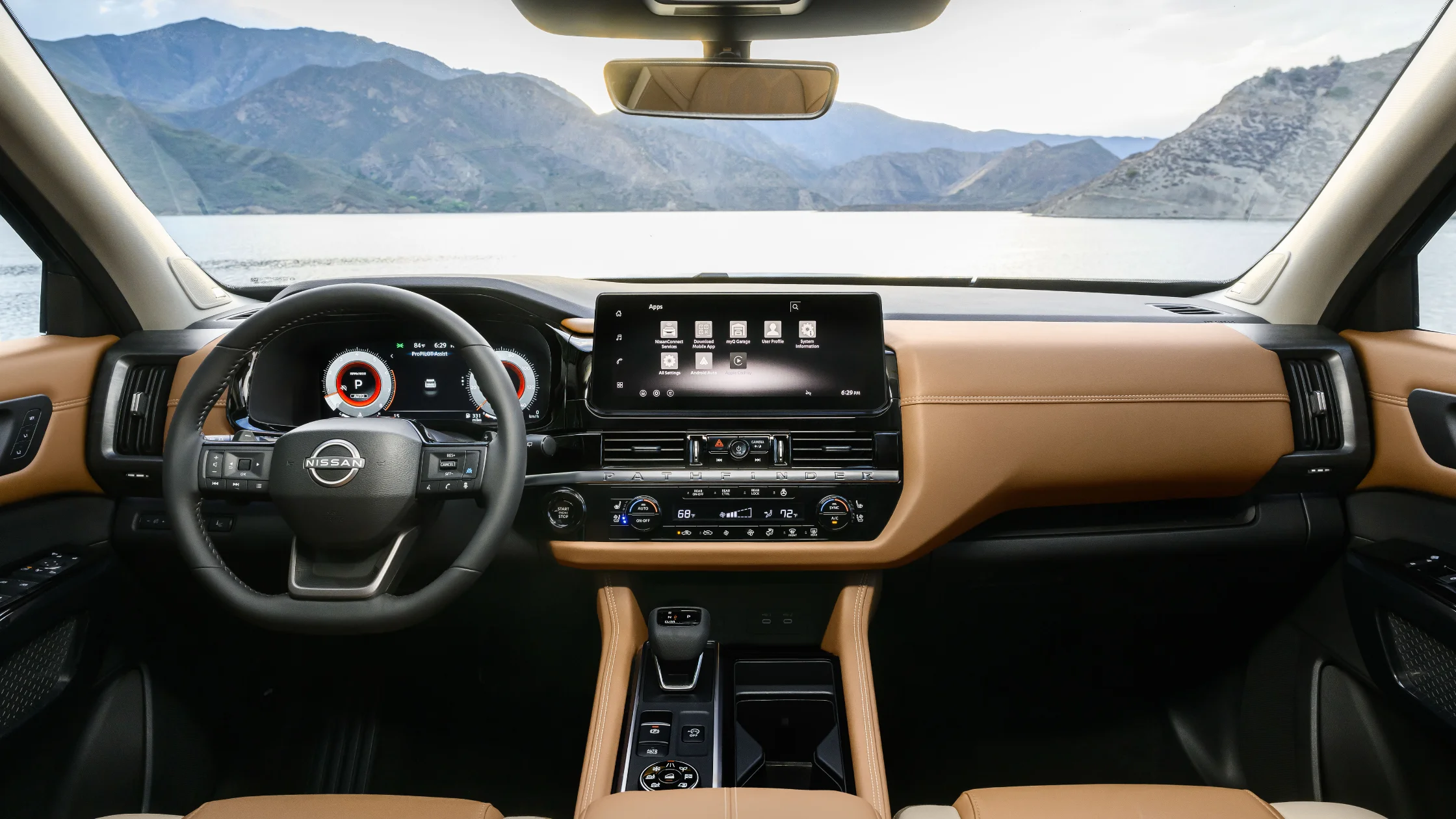 2026 Nissan Pathfinder® interior dashboard with touchscreen display tan leather trim and center controls