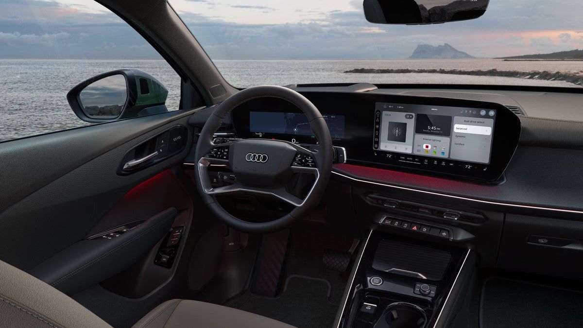 2026 Audi Q3 interior with the Digital Stage curved display panel spanning the dashboard