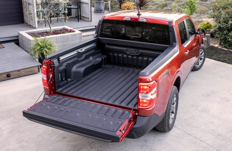 empty cargo bed of a red 2022 Ford Maverick