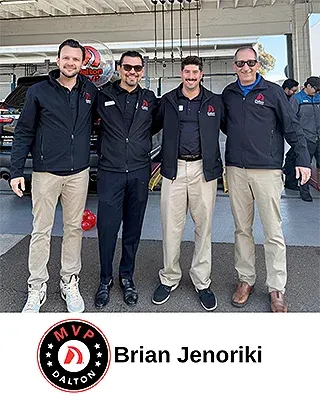 Brian Jenoriki with Dalton Subaru team members