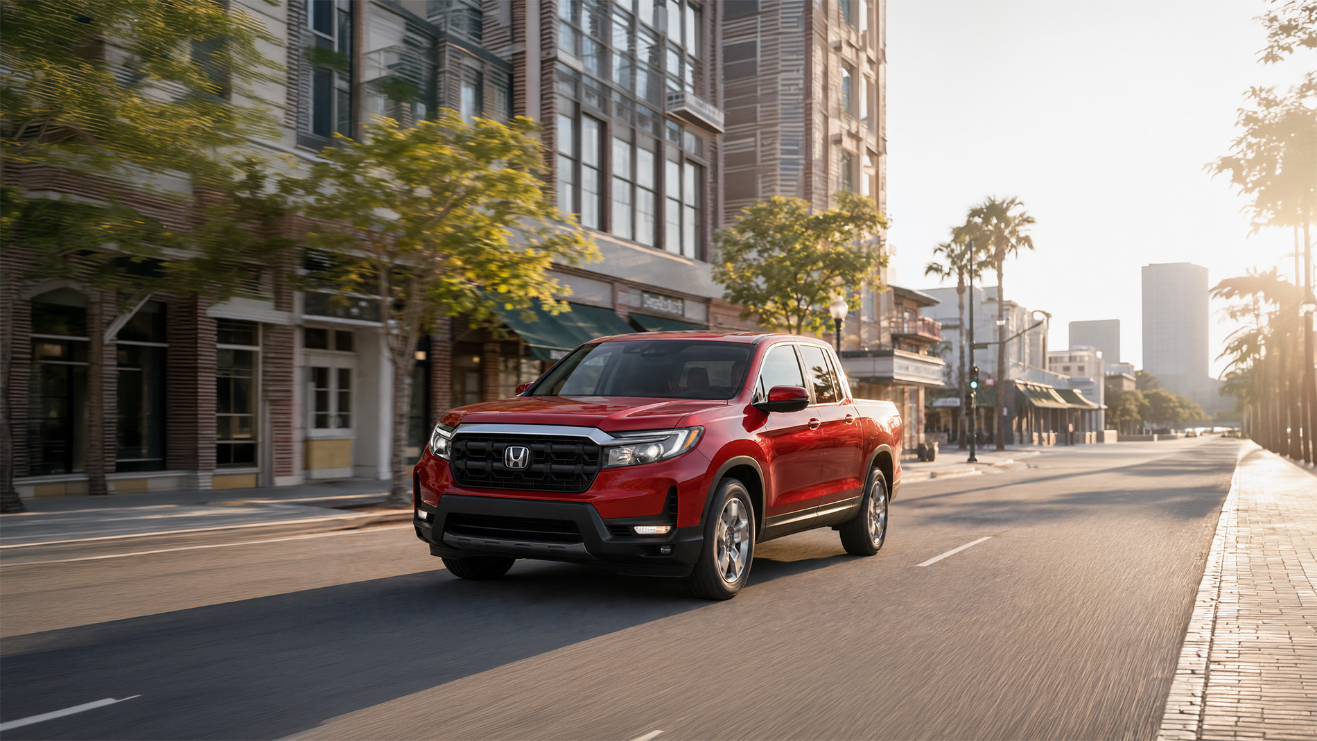 2026 Honda Ridgeline RTL trim level driving through a city