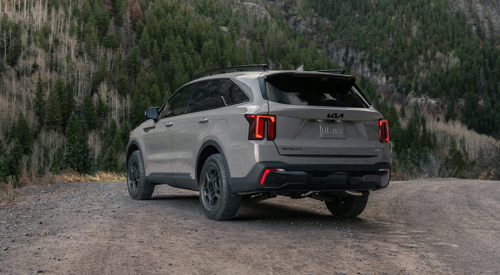 Rear of a grey 2026 Kia Sorento parked off-road