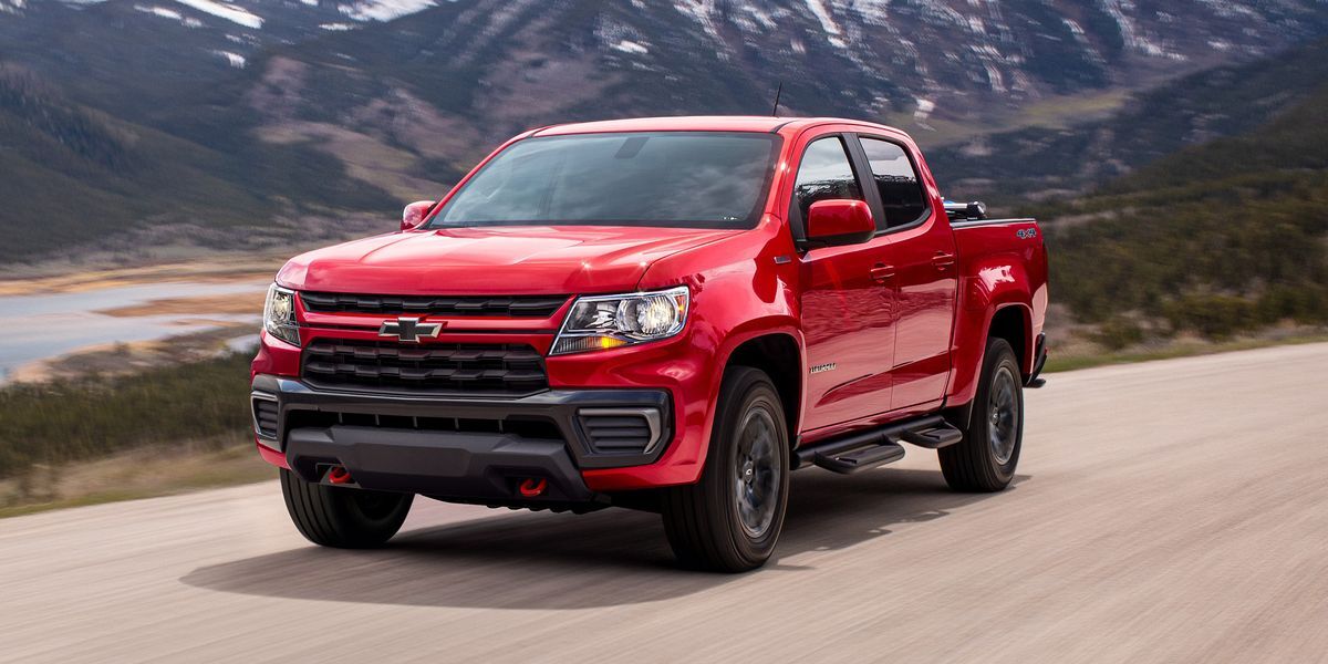 A red colorado driving on the raad.